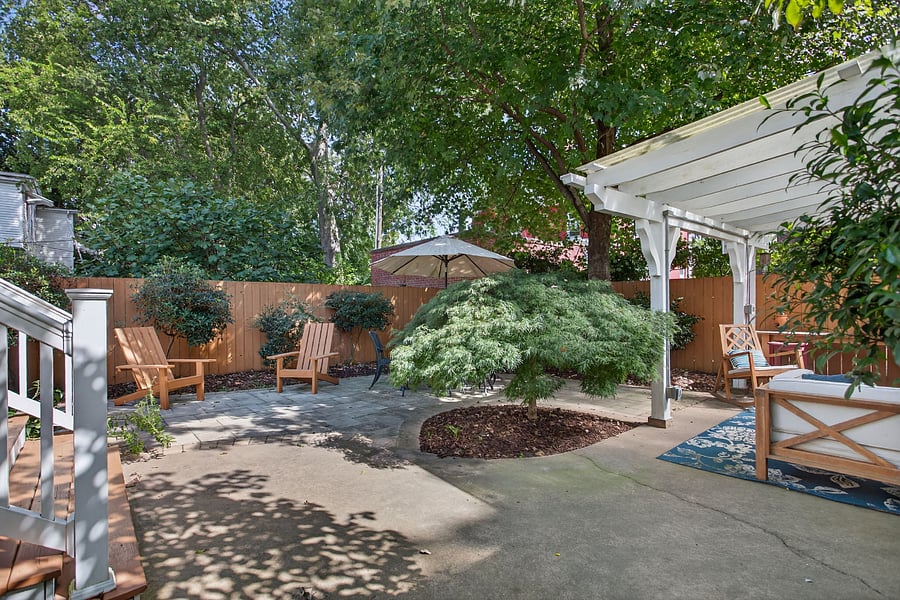 Cozy outdoor patio with dining and LR seating and TV