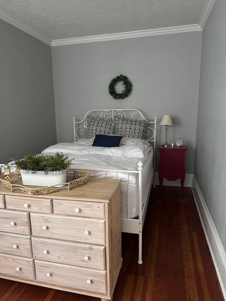 Bedroom with queen size bed and dresser
