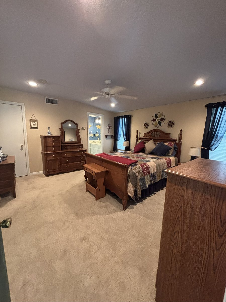 Bedroom one - Queen Bed, private ensuite bath, has it's own thermostat and private back door entrance off porch