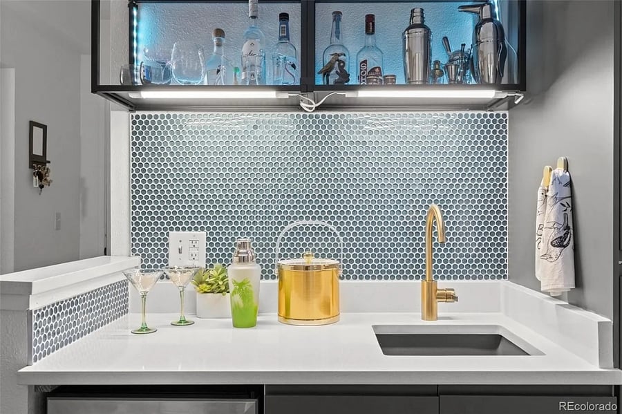 Wet bar with sink, shelving, and below counter beverage chiller