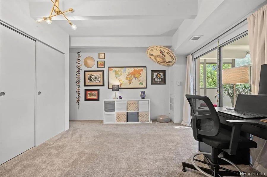 The second bedroom is flooded with light during the day, making it an excellent office space. If used as a bedroom the blackout curtains and barn doors provide a dark, restful space.