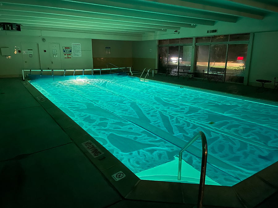 The indoor pool is heated and available 24 hours/day. The hot tub is in the background.