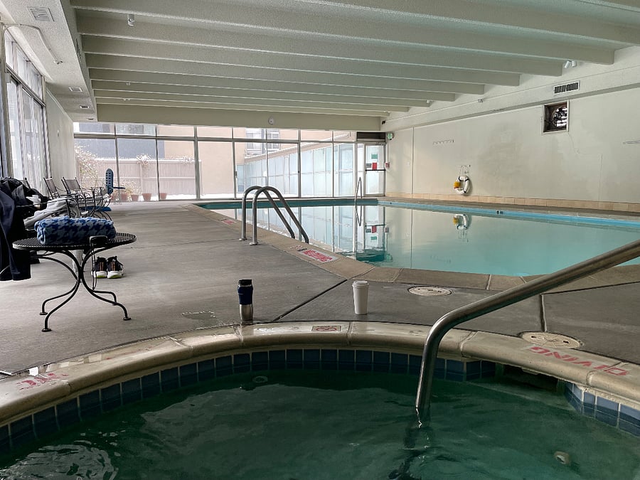 The indoor pool is heated and available 24 hours/day. The hot tub is in the foreground.
