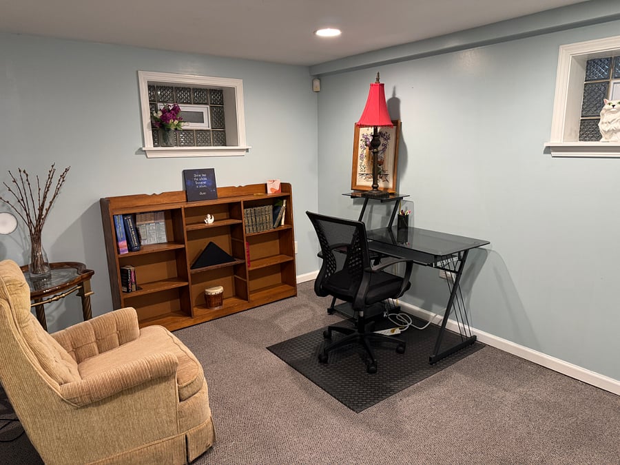 This office/study space has a door for privacy even while others are watching TV or playing games.