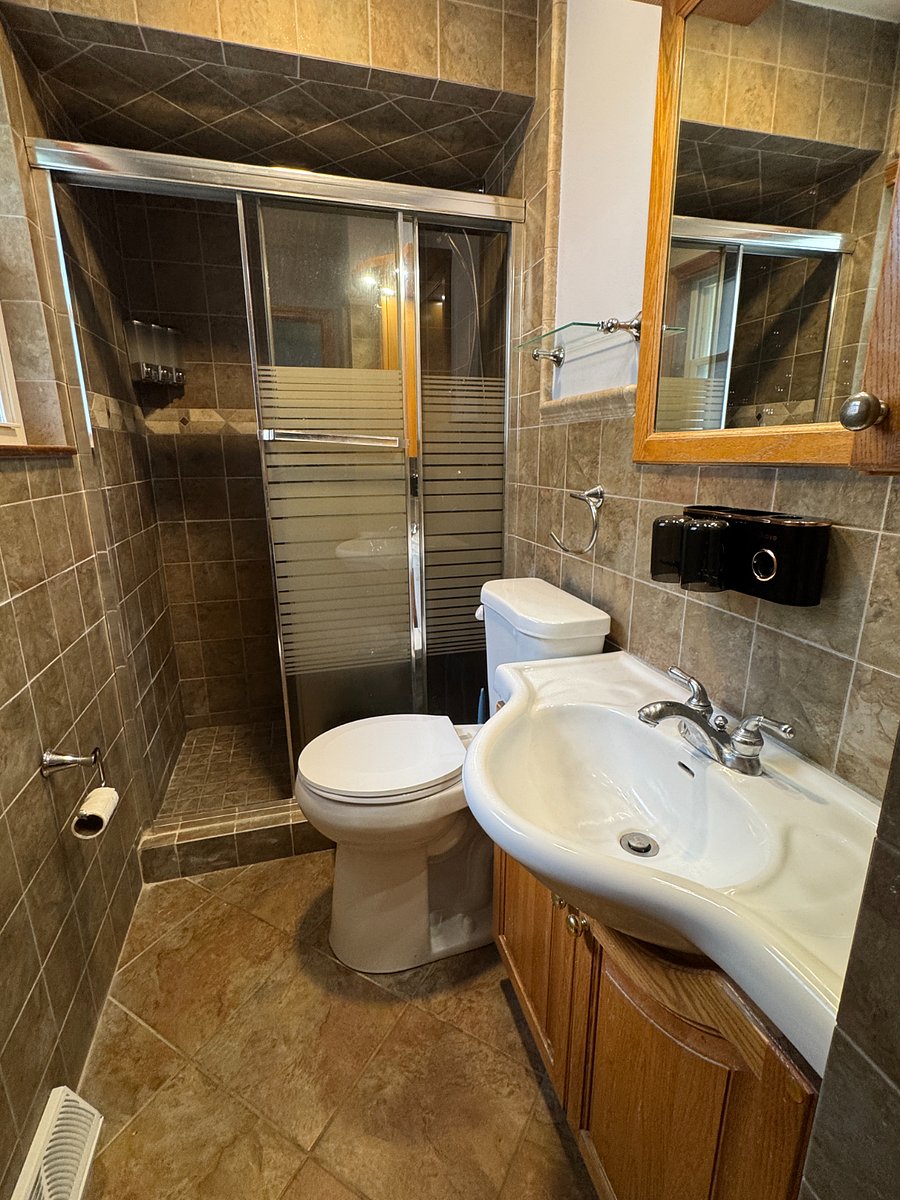 Private en-suite bath with walk-shower.