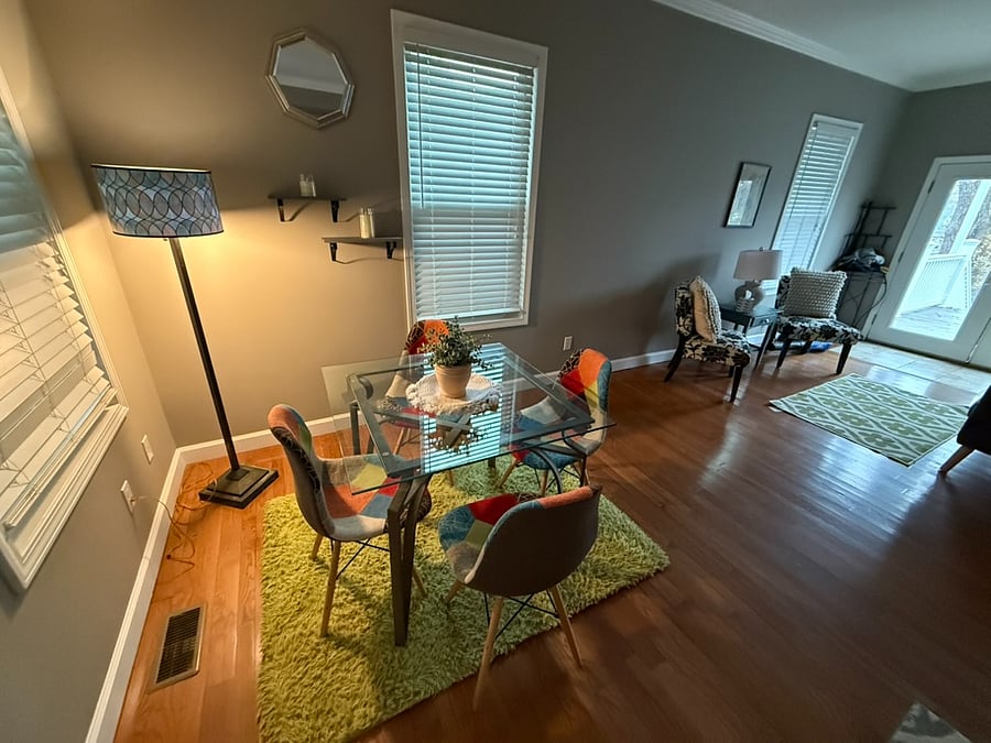 Dining area and additional sitting area near back door. Large deck out back with gas BBQ grill and fire pit