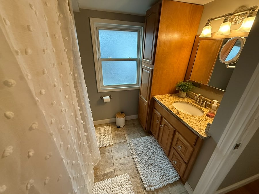 Upstairs bathroom with tub shower combo, light up make up mirror