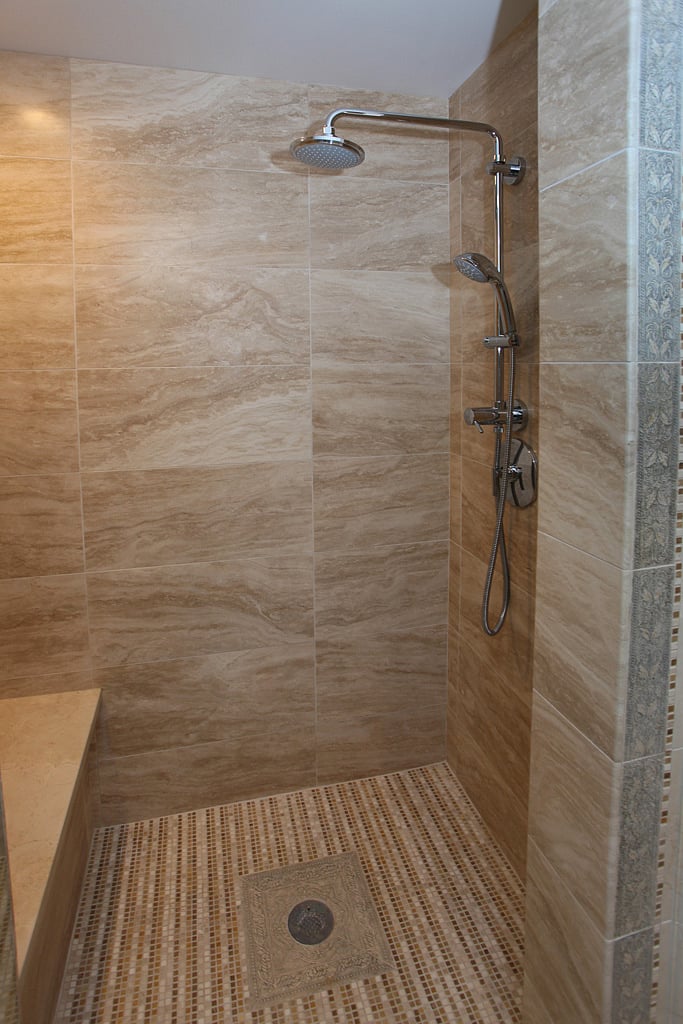 Master bath walk in shower with bench seat and rain shower (also has handheld movable shower head)