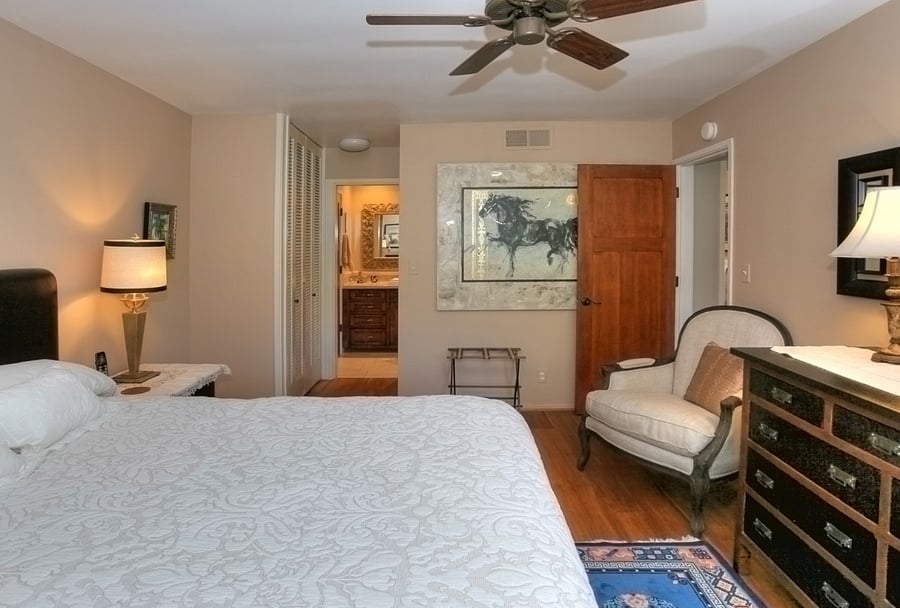 Master bedroom looking towards on suite master bath - artwork has been changed but similar style