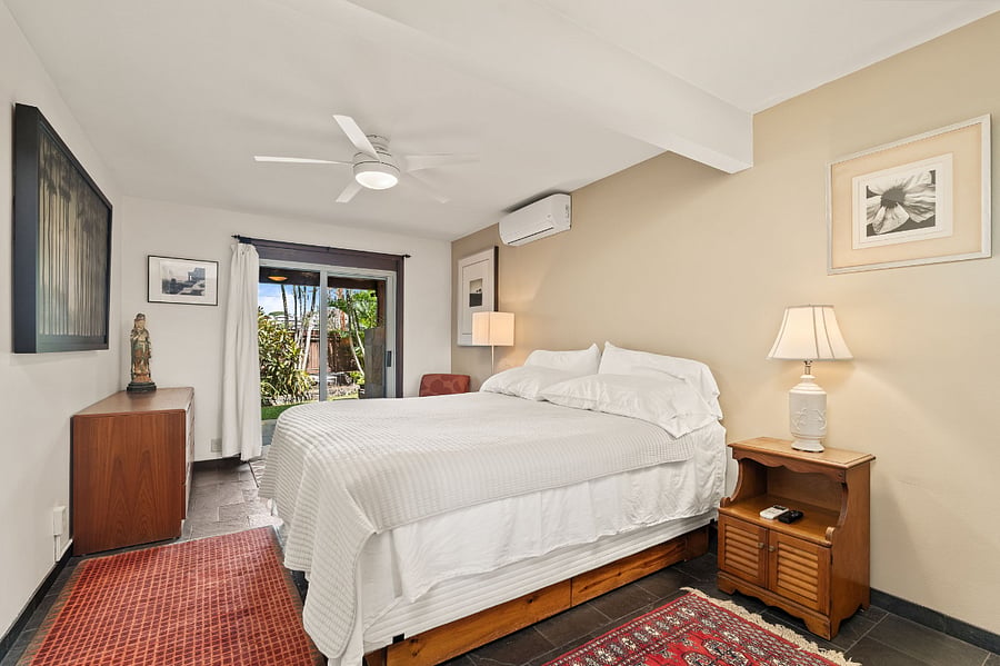 Bedroom looking towards sliding glass doors out to garden and Lanai