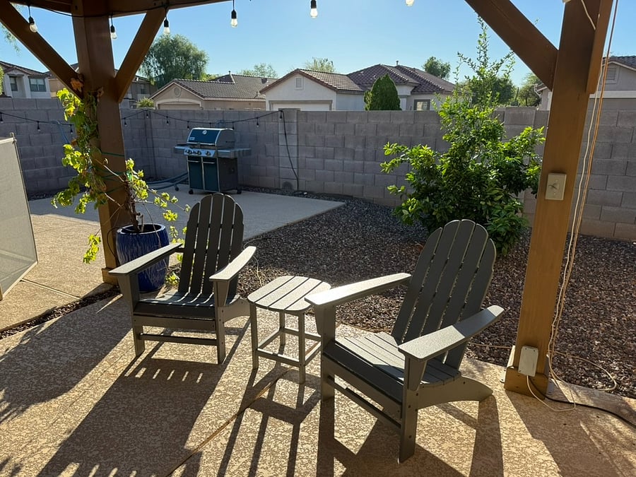 Grill, covered outdoor sitting, citrus trees in the side yard