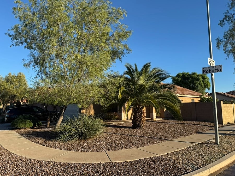 Situated on a corner lot on a side street. Across the street is a green space.