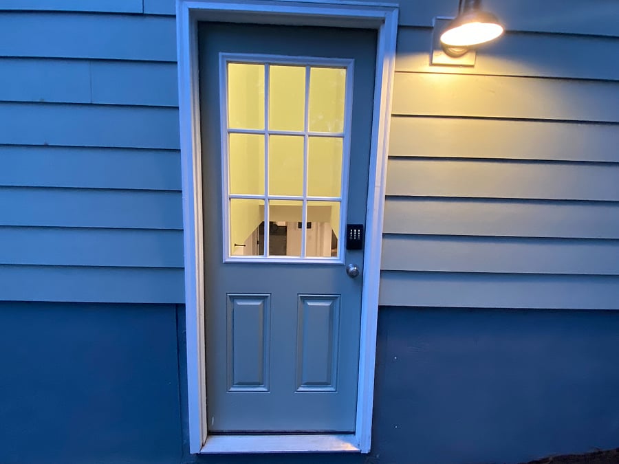 Well lit entrance with secure digital lock. 