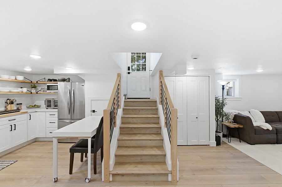 View from the bottom of the stairs to entry door.