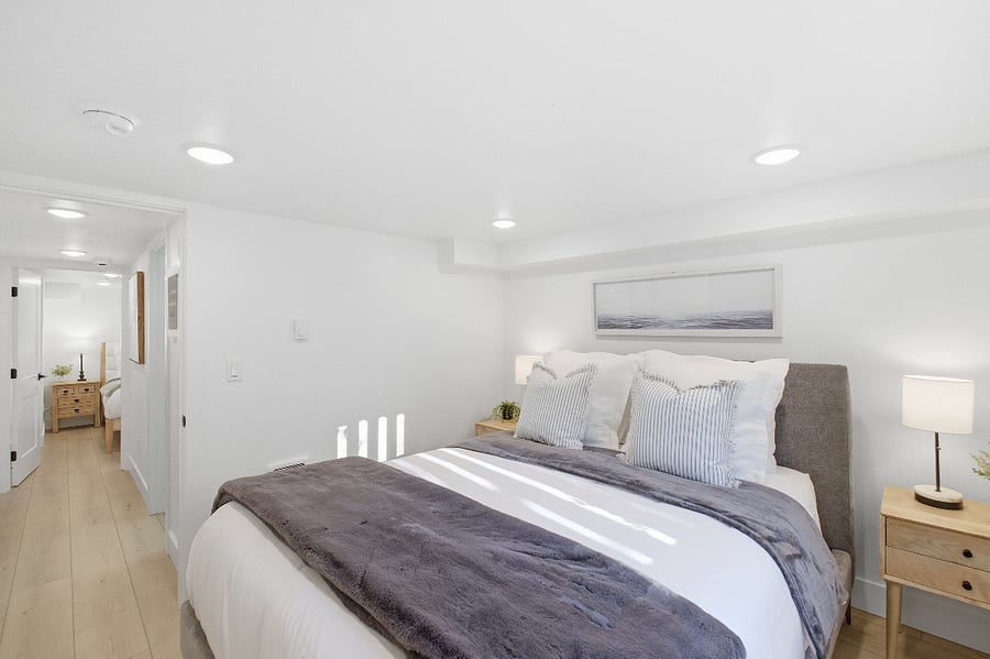 South bedroom. Queen bed. Wall mounted streaming ready TV