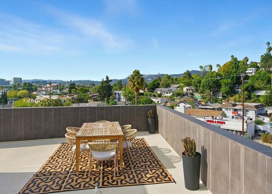 roof deck dining area - not shown: hammock, grill, and two sun loungers. 