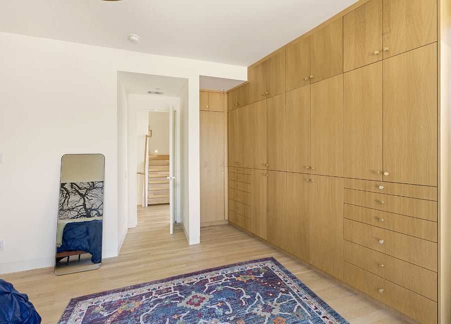 Primary bedrooms, closet, and storage space.