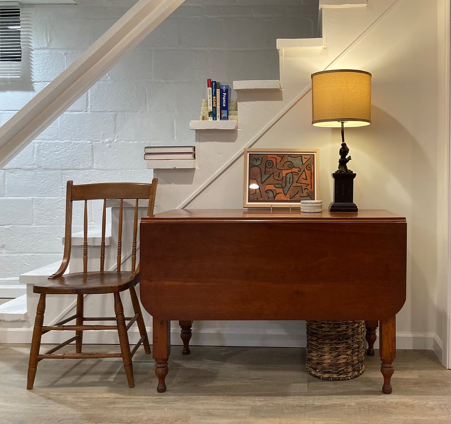Drop-leaf table expands for work or dining.