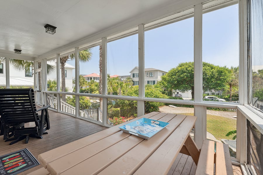 Back Porch with Picnic table and several chairs