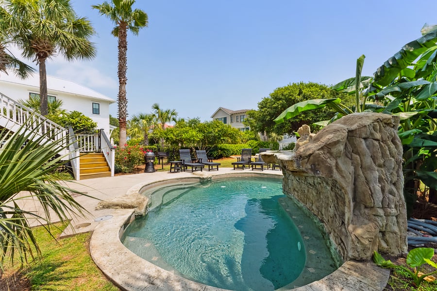 More views of pool with Waterfall in Backyard