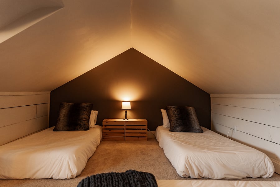 Bedroom 4, converted from attic. 3 floor mattresses. 6' at its peak and slopes suddenly. Great room for kids.