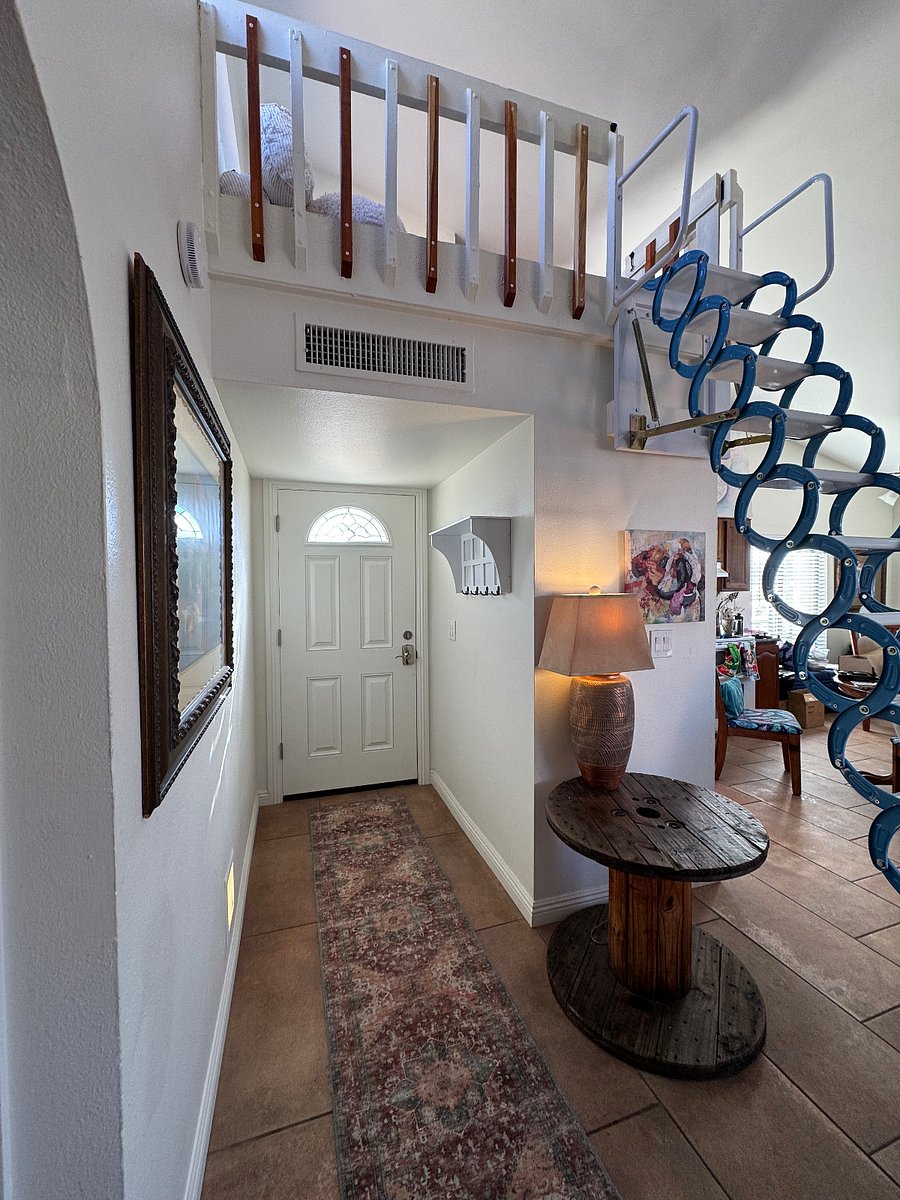 Front door with loft stairs expanded.