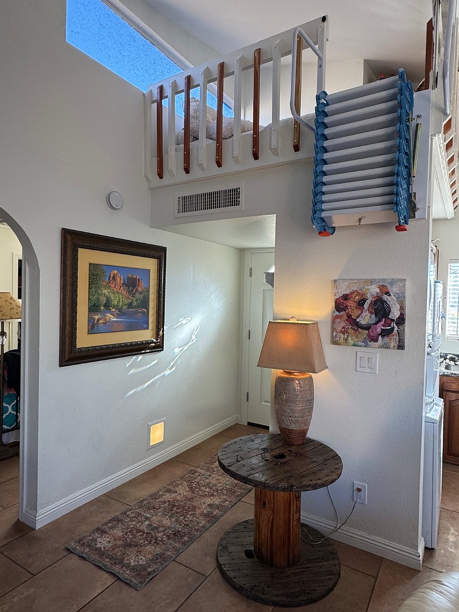Front door with loft stairs collapsed.
