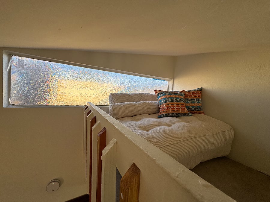 Loft sitting area which can turn into a double bed.
