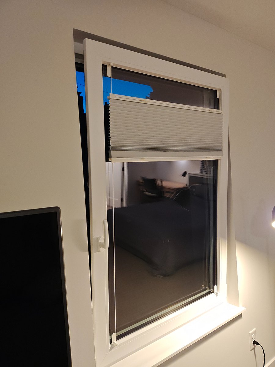 The european-style windows are tilt-open but they also swing fully open. Screens are installed. Blinds are blackout material.