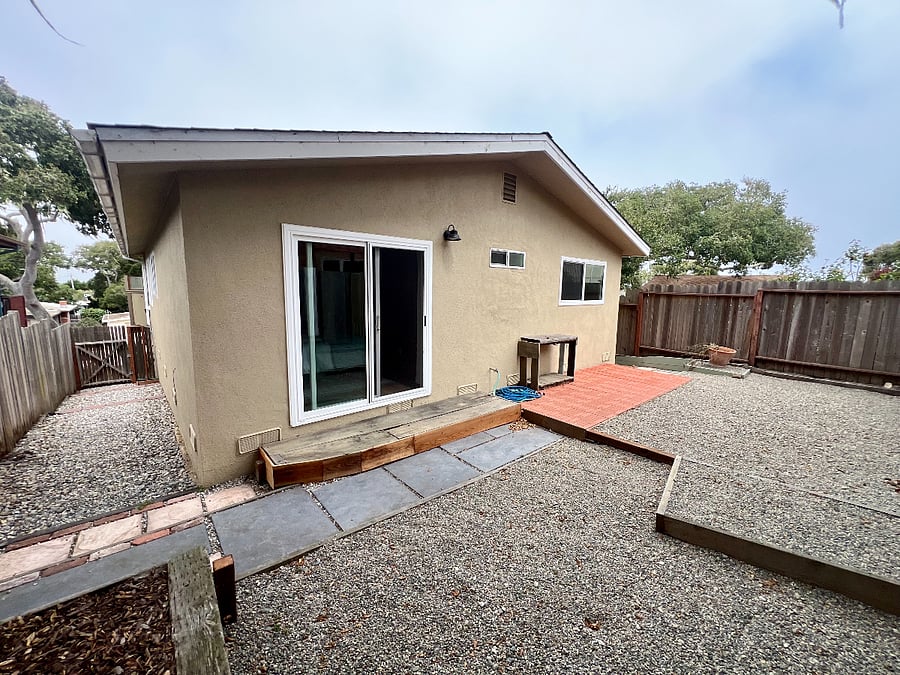 Backyard with a small patio.