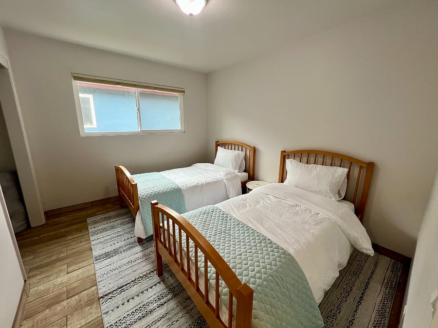Two twin beds flank the third bedroom.