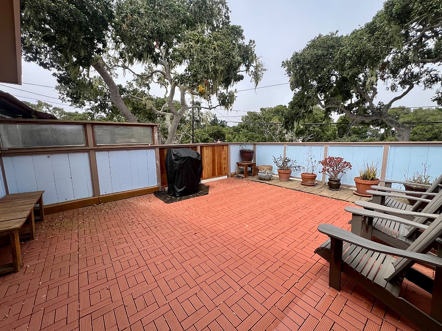 The front balcony with lounge chairs and a new gas grill.