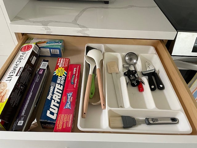 Cooking utensils, and starter supply of paper/plastic kitchen supplies.