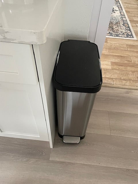 Large step-on garbage receptacle.