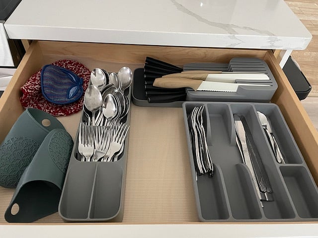Utensils, knives, serving ware, oven mitts and hot pads.