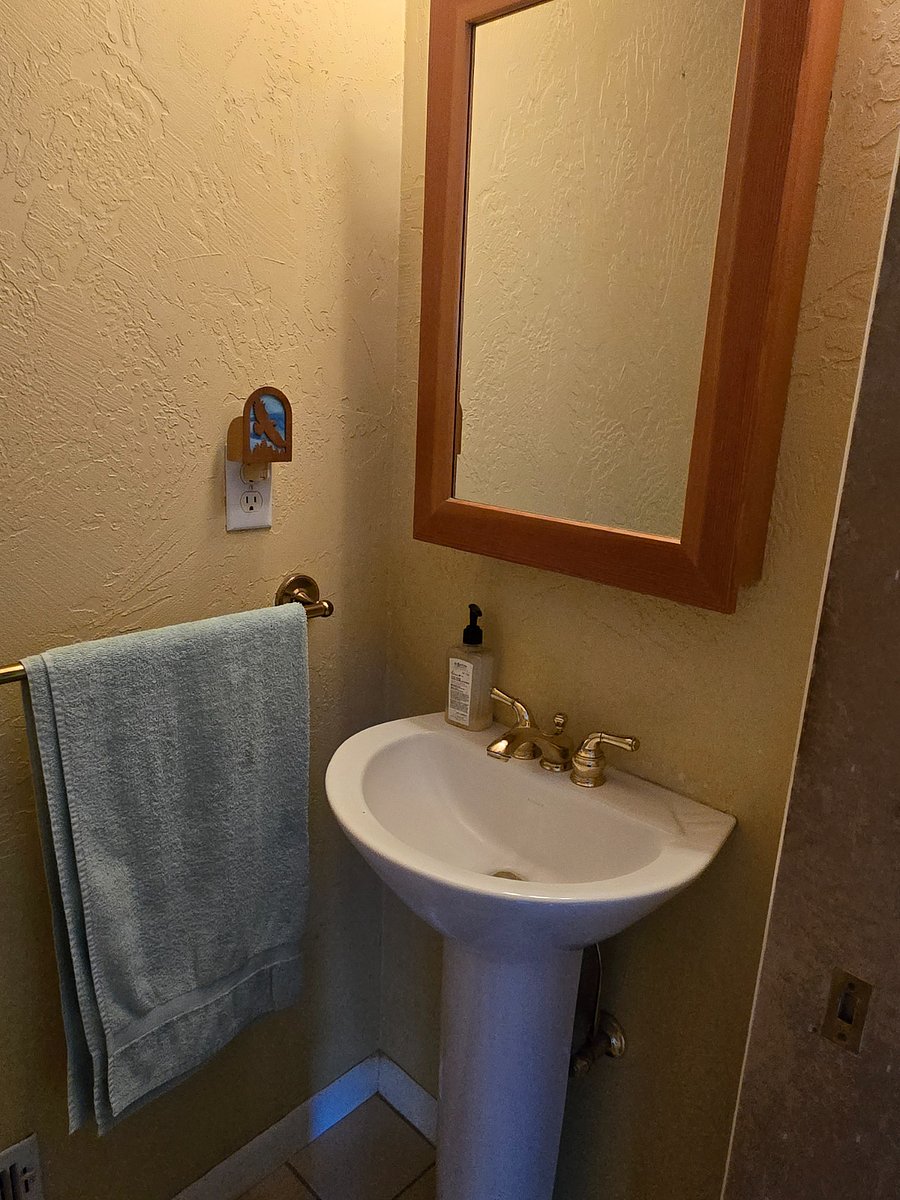 Half Bath between bedrooms and utility.