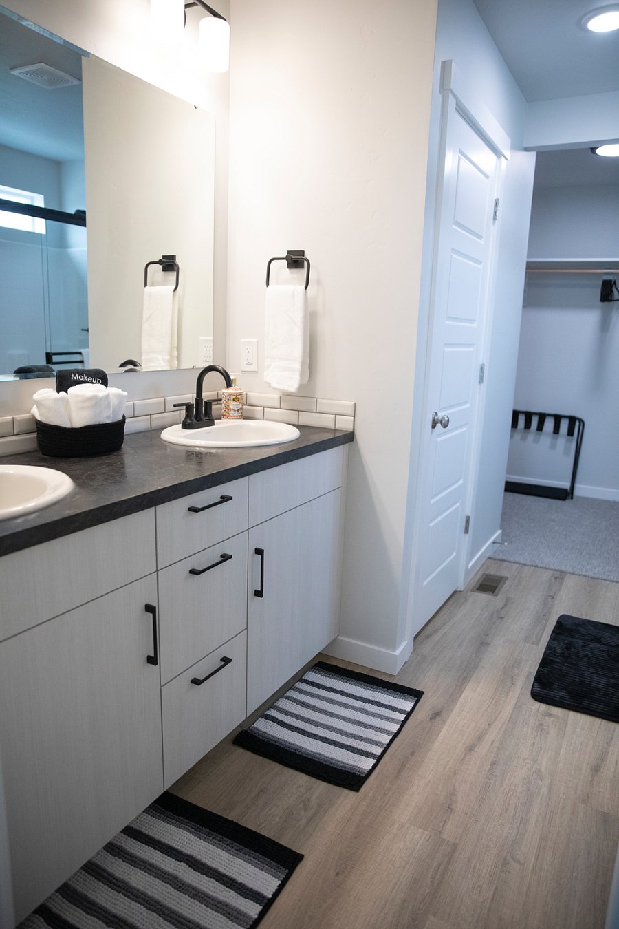 Master bathroom with closet, toilet room and walk in shower 