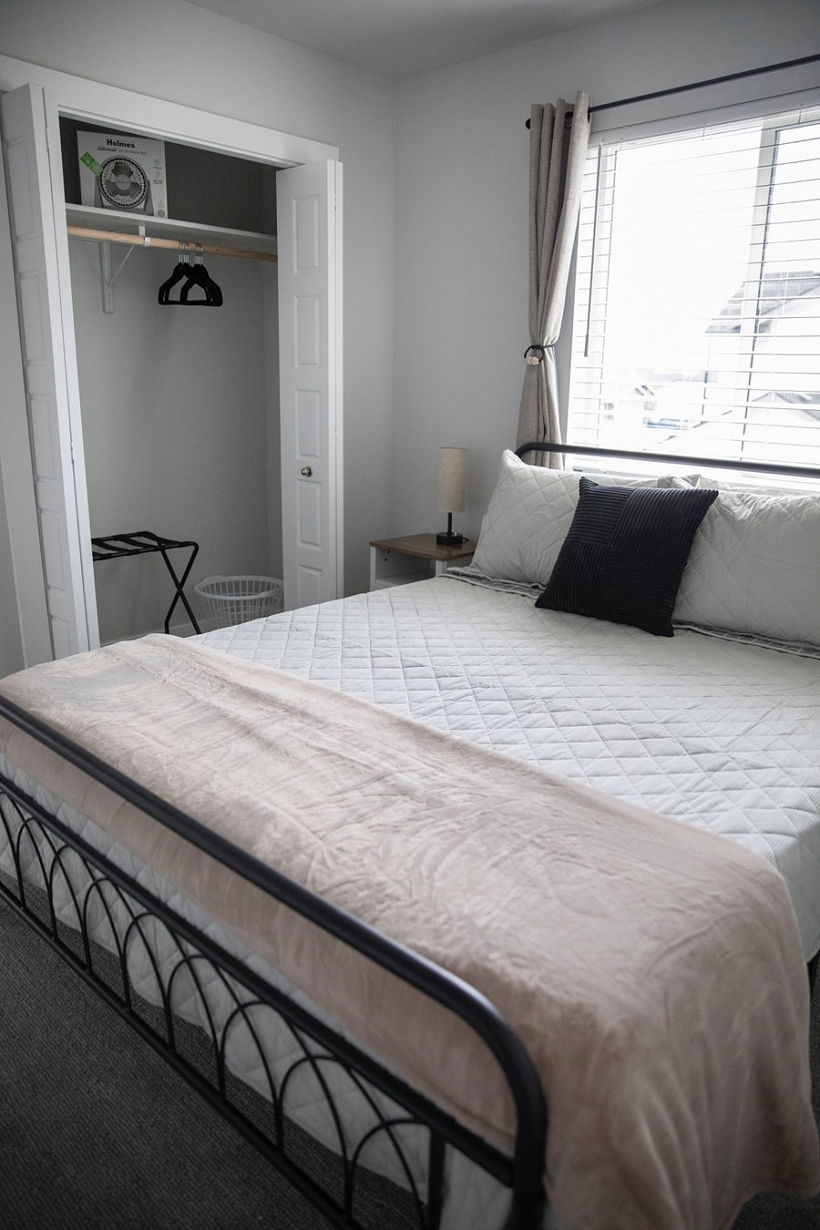 Other queen room with small dresser, 43 inch tv and closet. Black out curtains. 