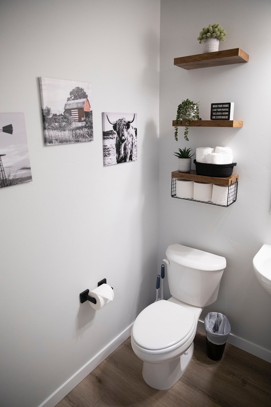 Downstairs half bath with a toilet and a sink. 