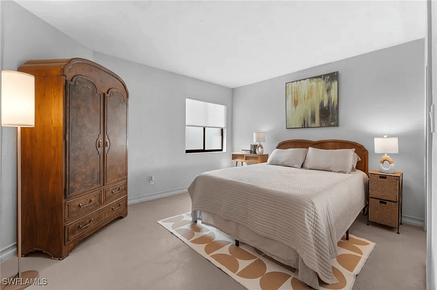 Guest bedroom has plenty of closet space and a desk.