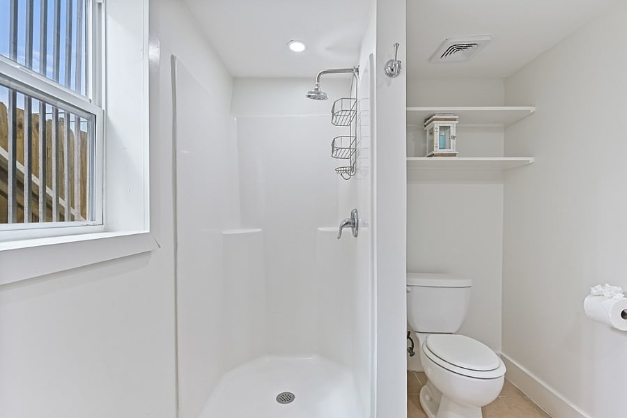 Separate Rental Downstairs | Private studio bathroom offers everything you need, including a full shower, vanity and toilet