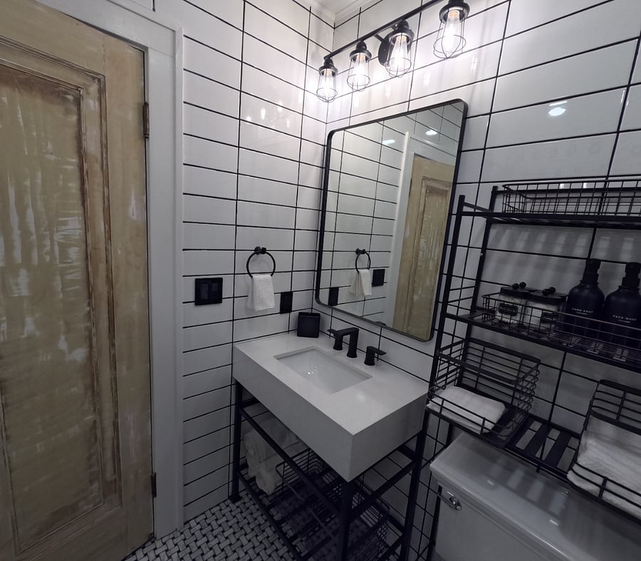 Beautifully remodeled Jack & Jill style bathroom with a fresh classic look & soft water shower..