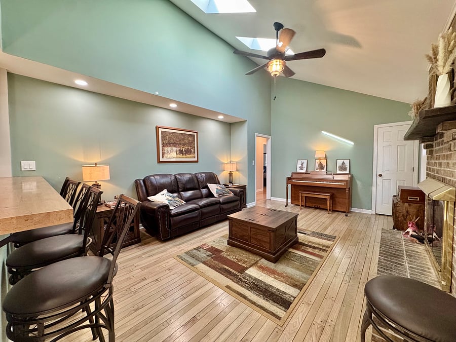 Den with vaulted ceiling and skylight. Enjoy relaxing to an occasional rain. Piano players welcome.