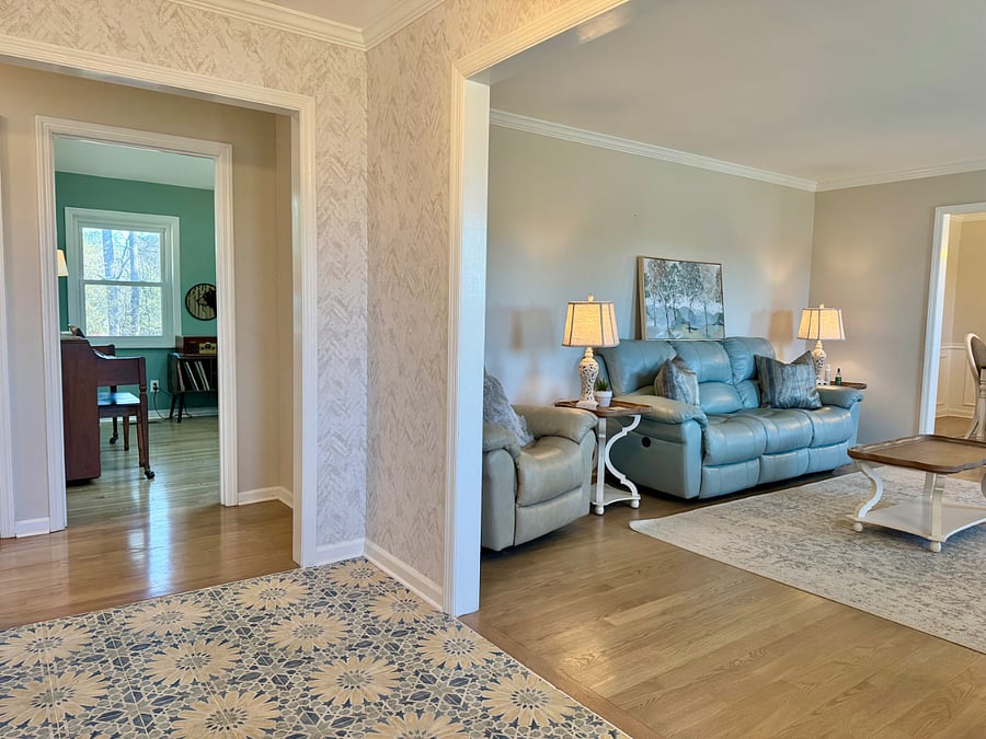 Entry way looking into den and living room.