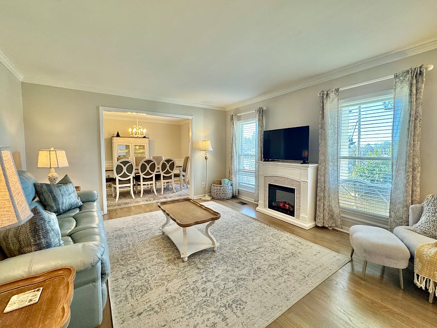 Living room has lake views from the windows.