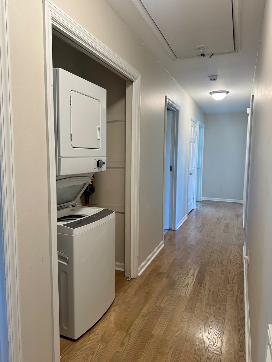 Washer and dryer in the hallway for convenience.