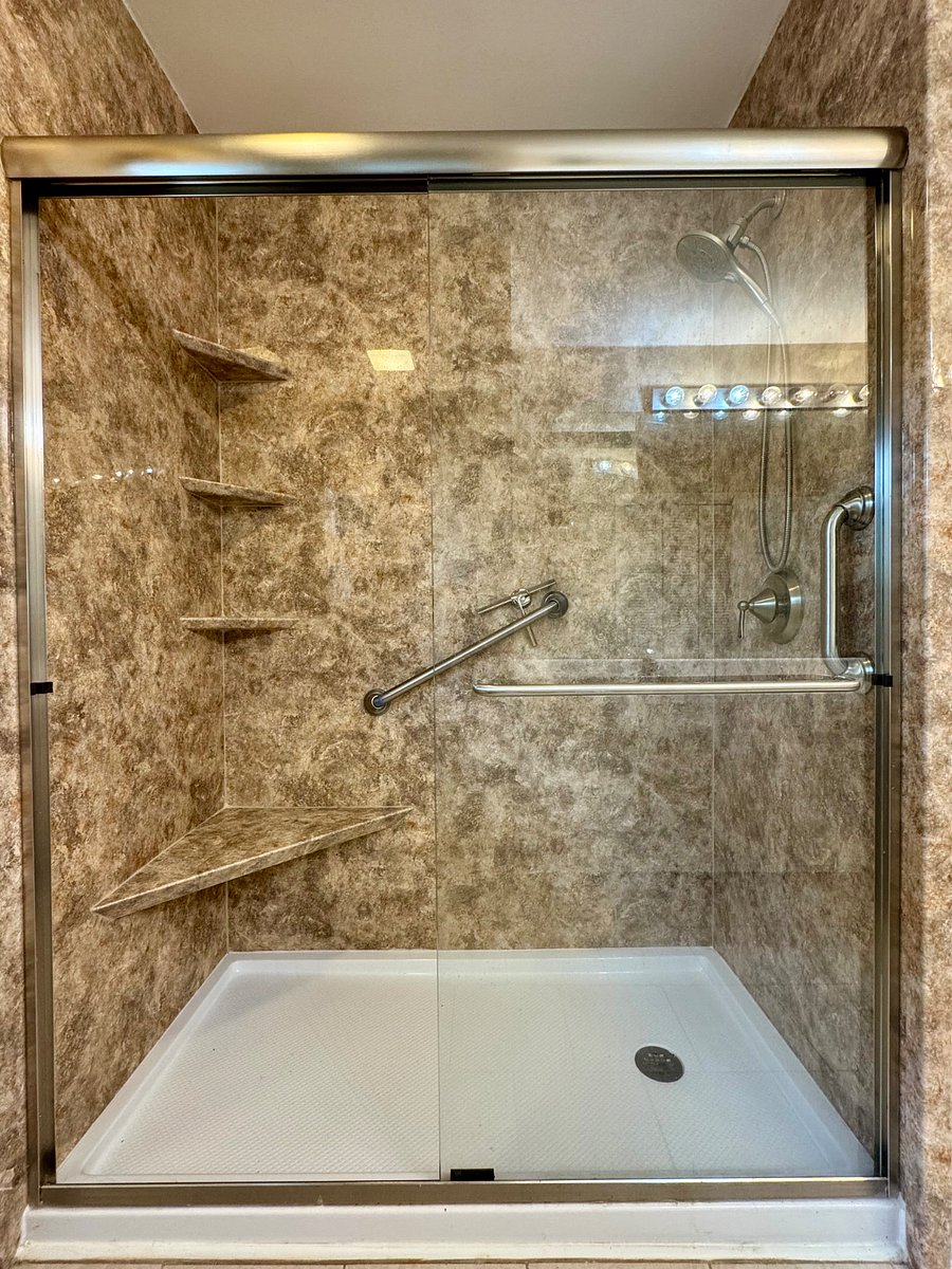 Walk in shower in hallway bath.