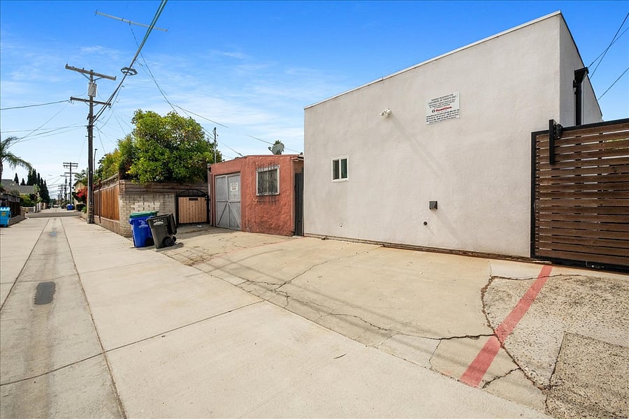 Parking space located behind unit in alley.