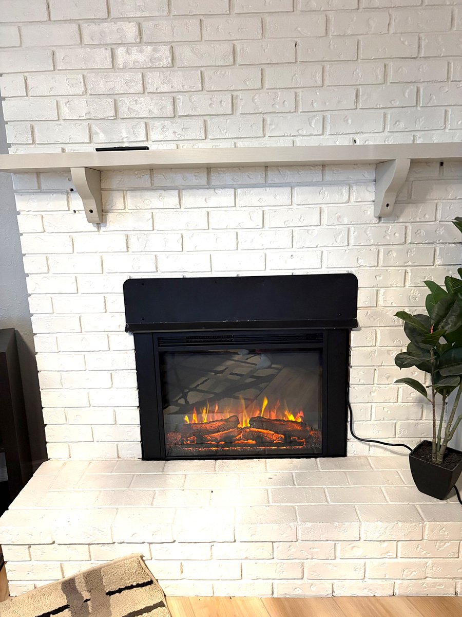 Electric heater and fireplace in living room
