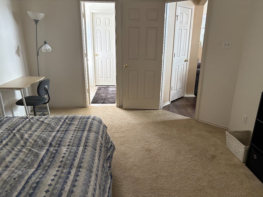 View of your bedroom from the head of the bed. To right is to living room, straight is bath/closet